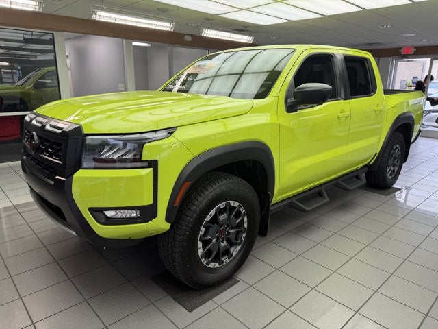 2026 Nissan Frontier PRO-4X in Citrus Strike — front three-quarter view