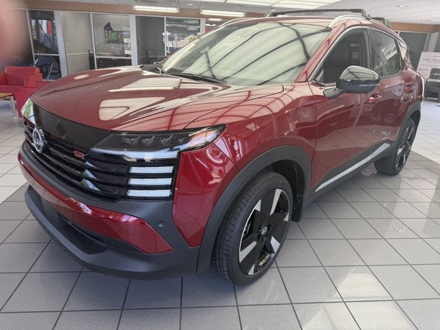 2026 Nissan Kicks SR in Scarlet Ember Tintcoat — front three-quarter view