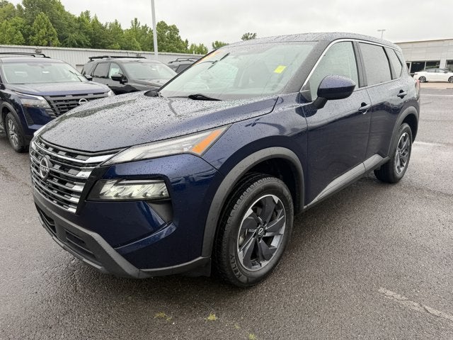 2024 Nissan Rogue SV in Deep Ocean Blue Pearl — front three-quarter view